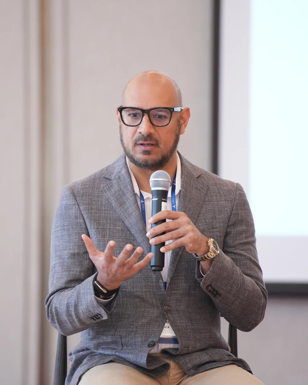 Mani speaking at a leadership event